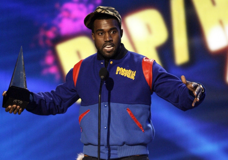 Kanye West accepts the rap/hip hop favorite male artist award at the American Music Awards in Los Angeles on Sunday, Nov. 23, 2008. (AP Photo/Matt Sayles)