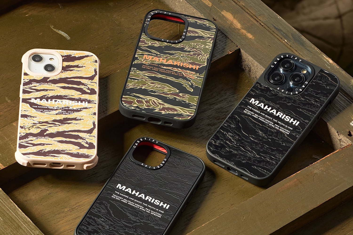 Maharishi collaborates with CASETiFY for a range of small accessories comprised of sustainably produced compostable and recycled cases. CASETiFY's production facilities are ISO14001-certified, for employing processes within their manufacturing such as rainwater collection, advanced recycling systems, fully circular sourcing for materials using plant-based & BPA free plastics as well as non-toxic soy based ink. Most notably within CASETiFY's Re/CASETiFY and Ultra Compostable line. The capsule features Maharishi's own DPM: Golden Tigerskins, a rare iteration of camouflage seen in the 60's in deep Vietnam as deployed advisor's would seek to make alterations to their uniforms in order to adapt to the climate. Contrasting typography finishes each case through Maharishi's MILTYPE - a contemporary take on MIL-SPEC marks which communicate the precise specifications of equipment. Available now at maharishistore.com, as well as in store Maharishi London and New York.
